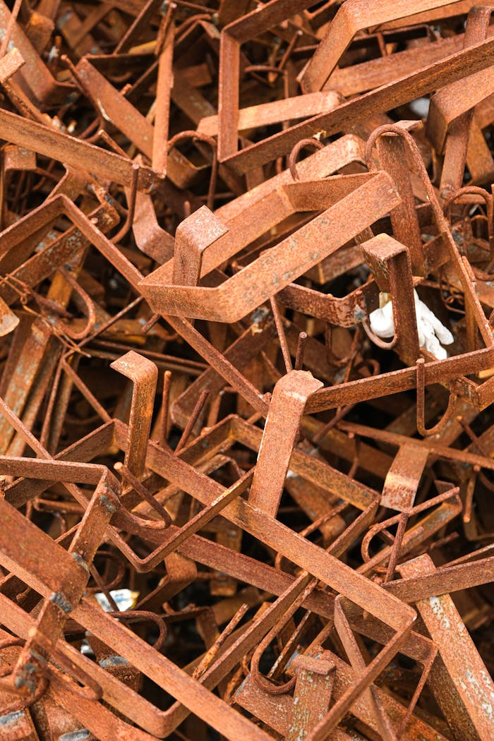 Detailed close-up of rusty metal scrap with selective focus, ideal for industrial themes.